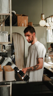 A man standing in a kitchen preparing food