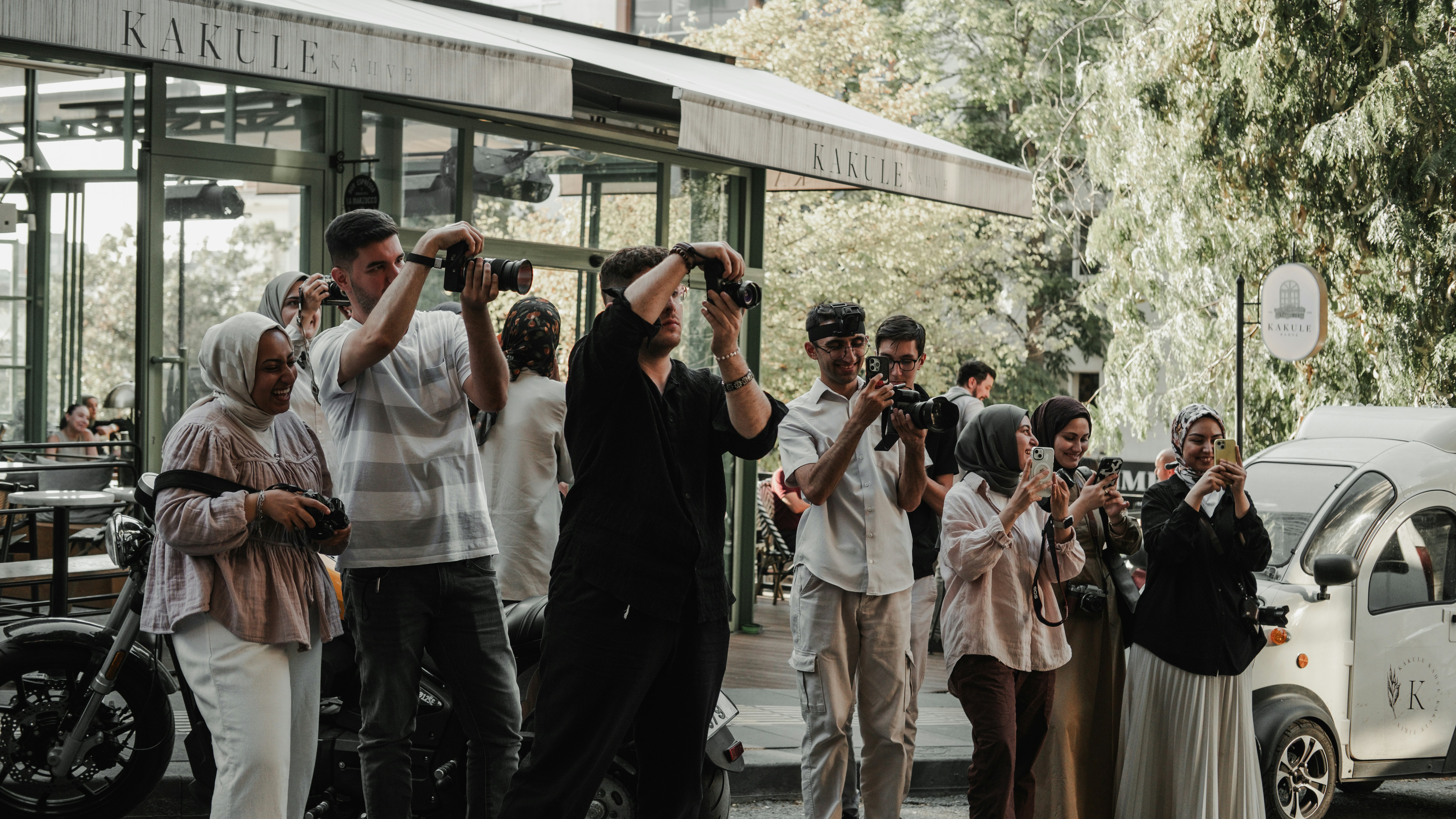A group of people standing in front of a building
