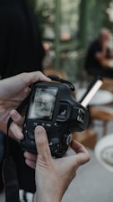A person holding a camera in their hand