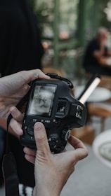 A person holding a camera in their hand