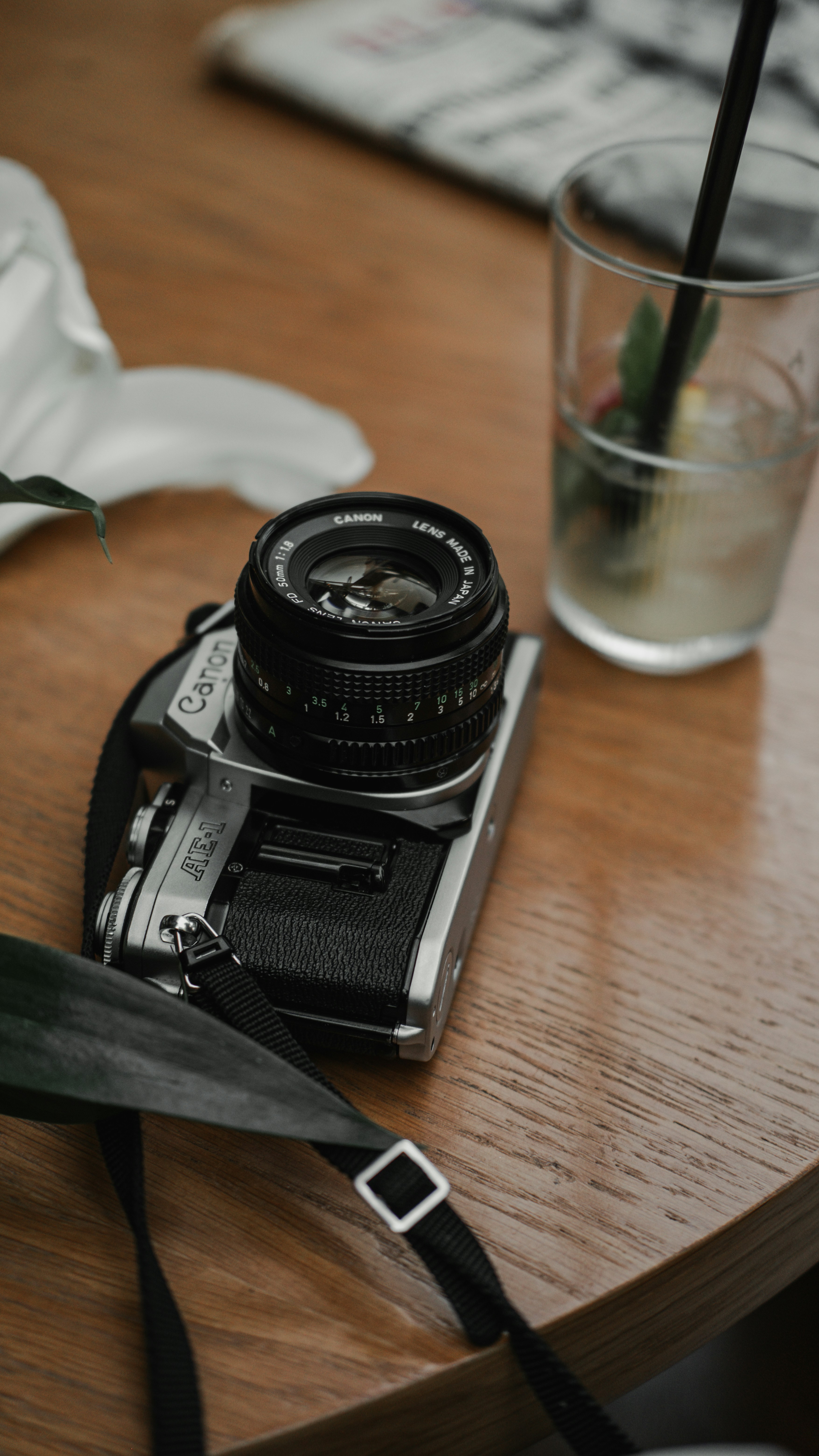 A camera sitting on top of a wooden table