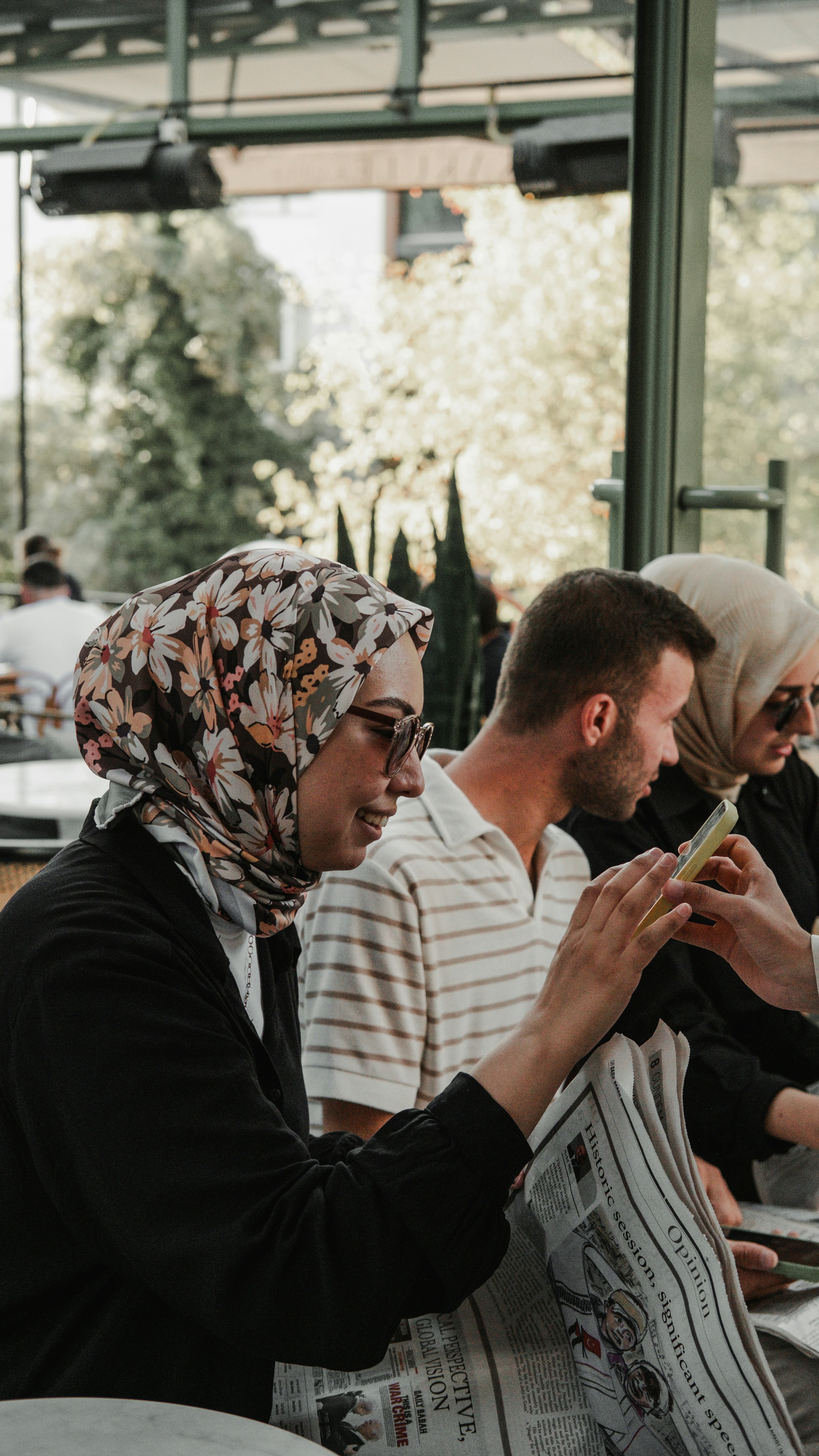 A group of people sitting at a table