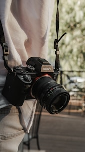 A person holding a camera in their hand