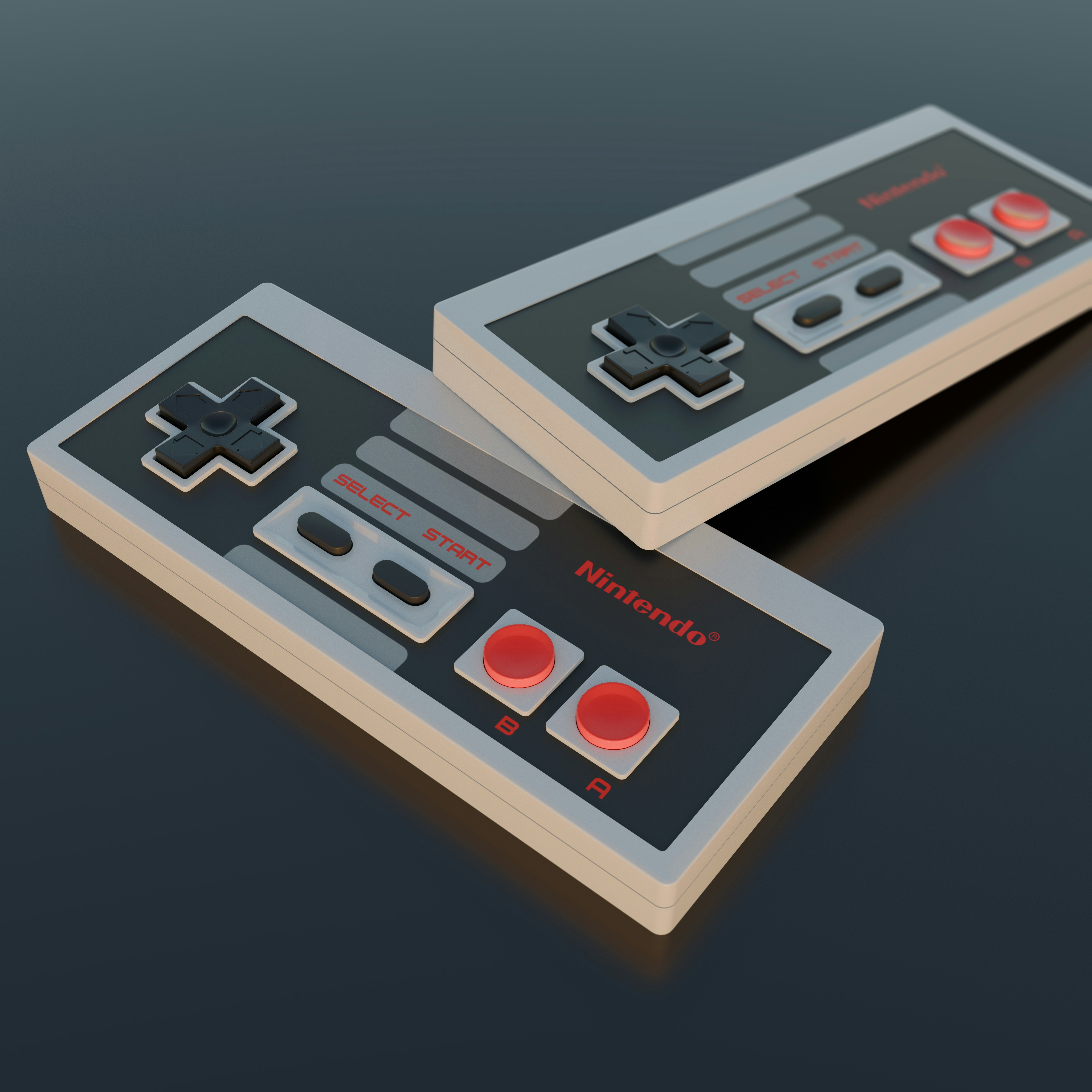 A pair of nintendo wii controllers sitting on top of a table