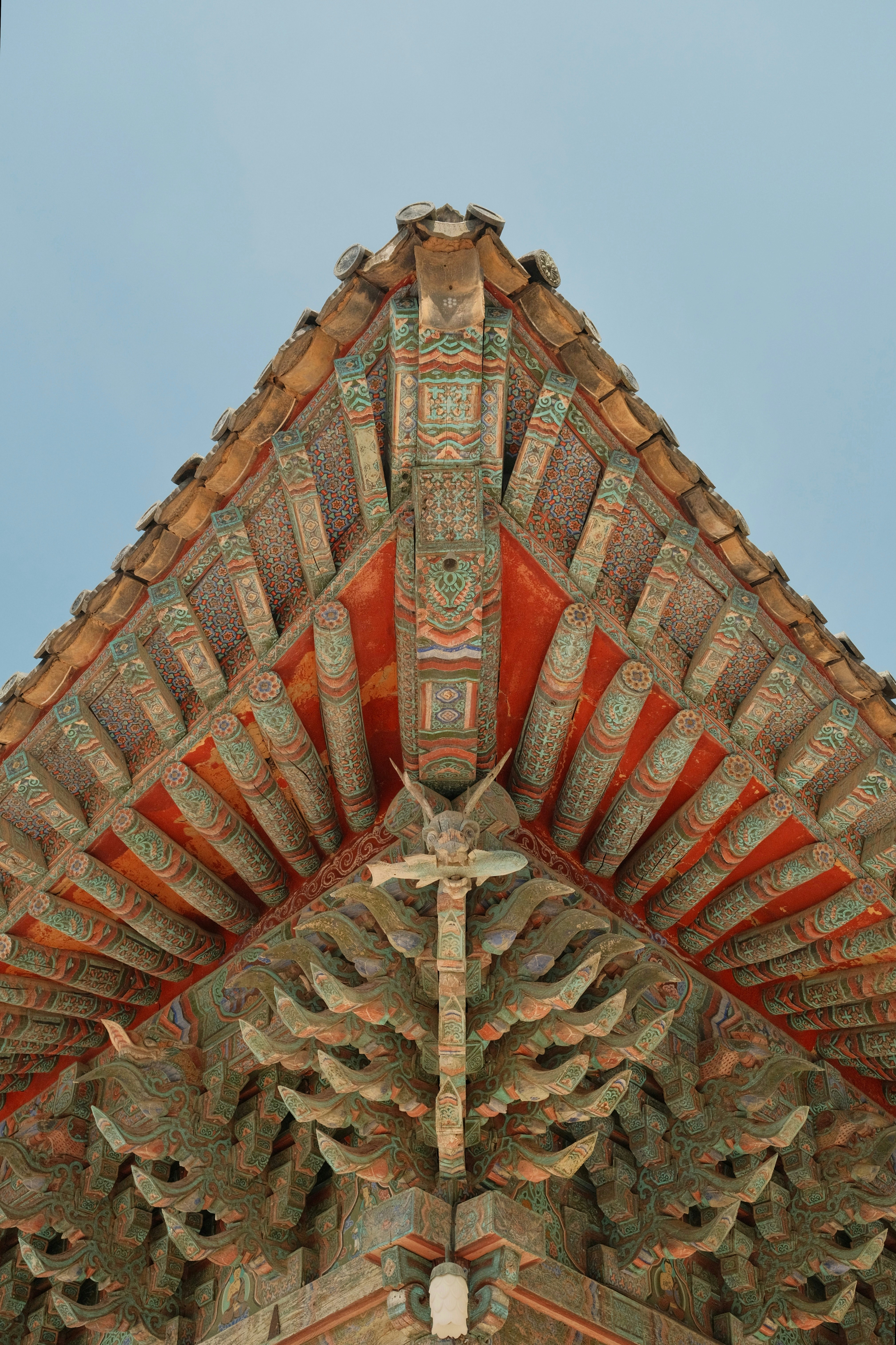 The top of a building with a clock on it