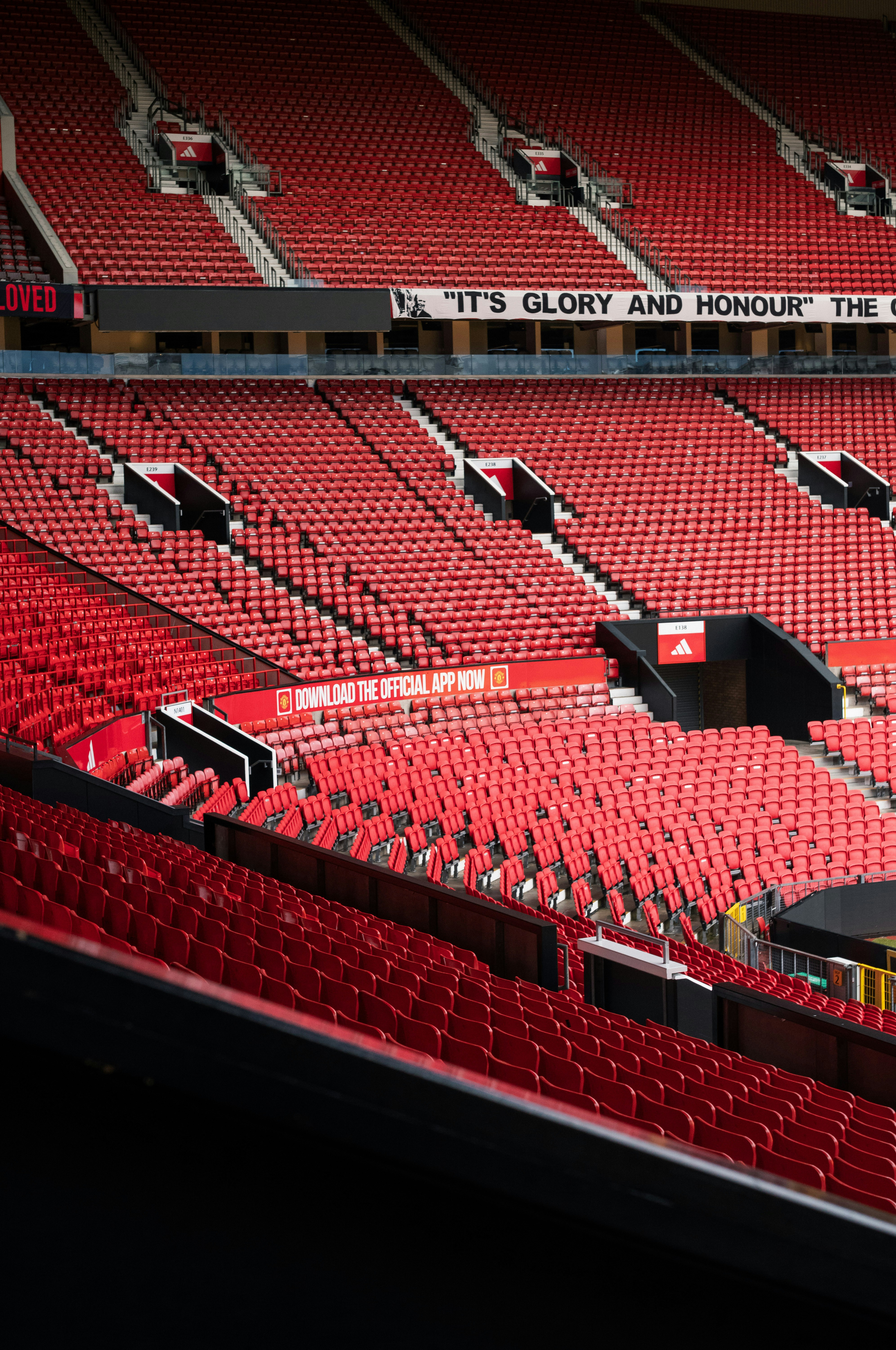 A stadium filled with lots of red seats photo – Free Indoors Image on ...