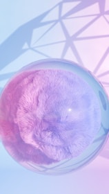 A purple teddy bear in a clear glass container