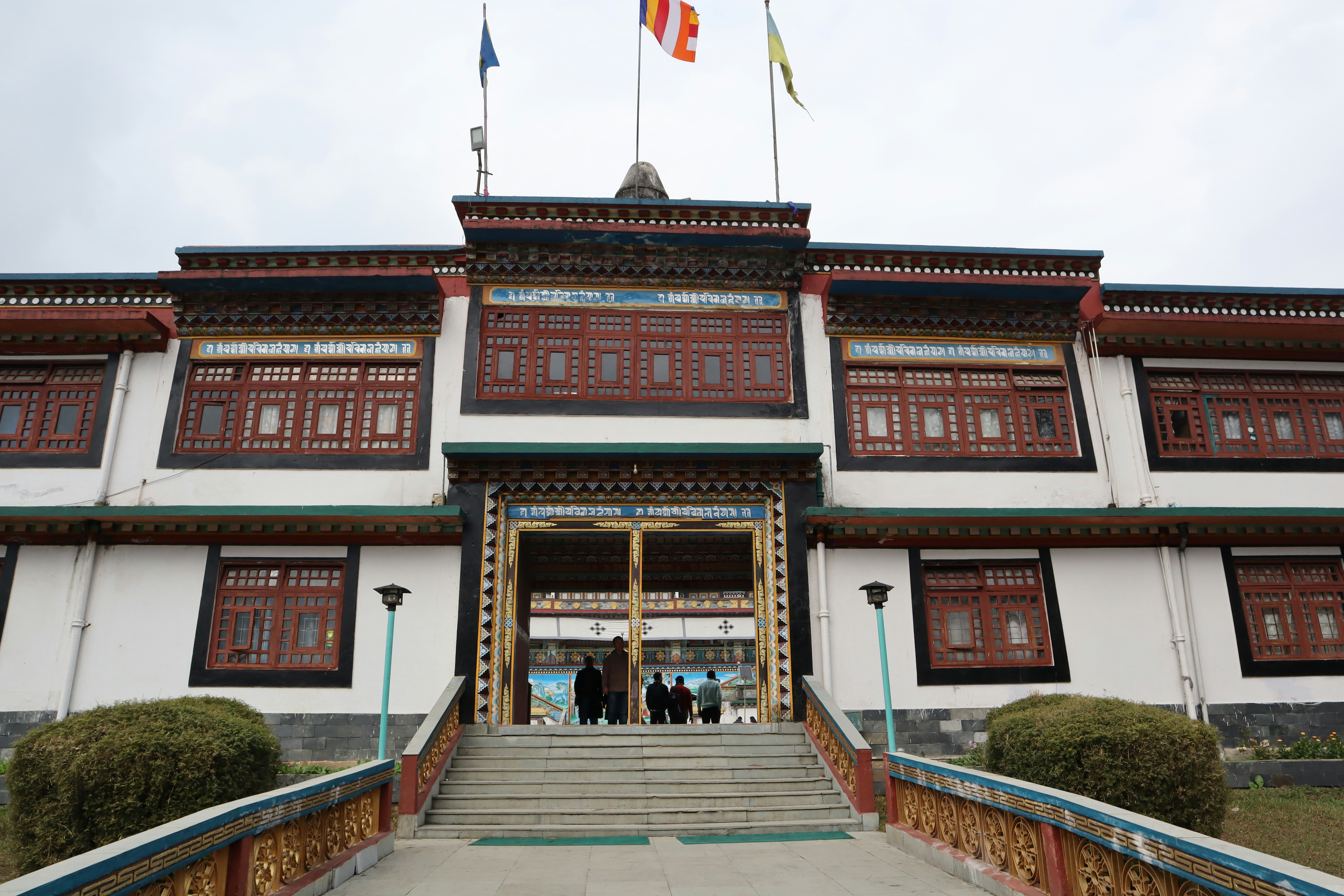 A large building with flags on top of it