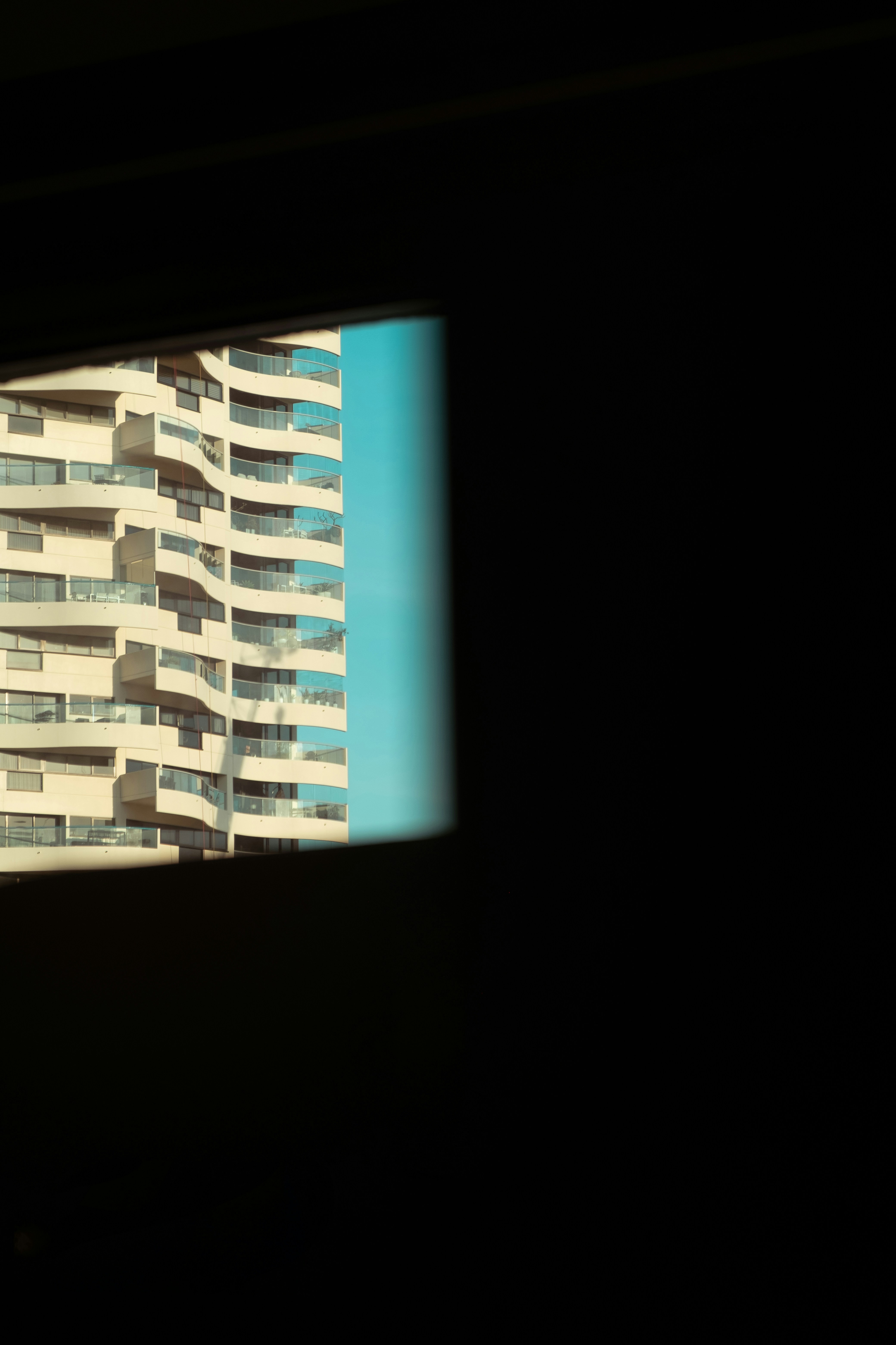 A view of a tall building through a window