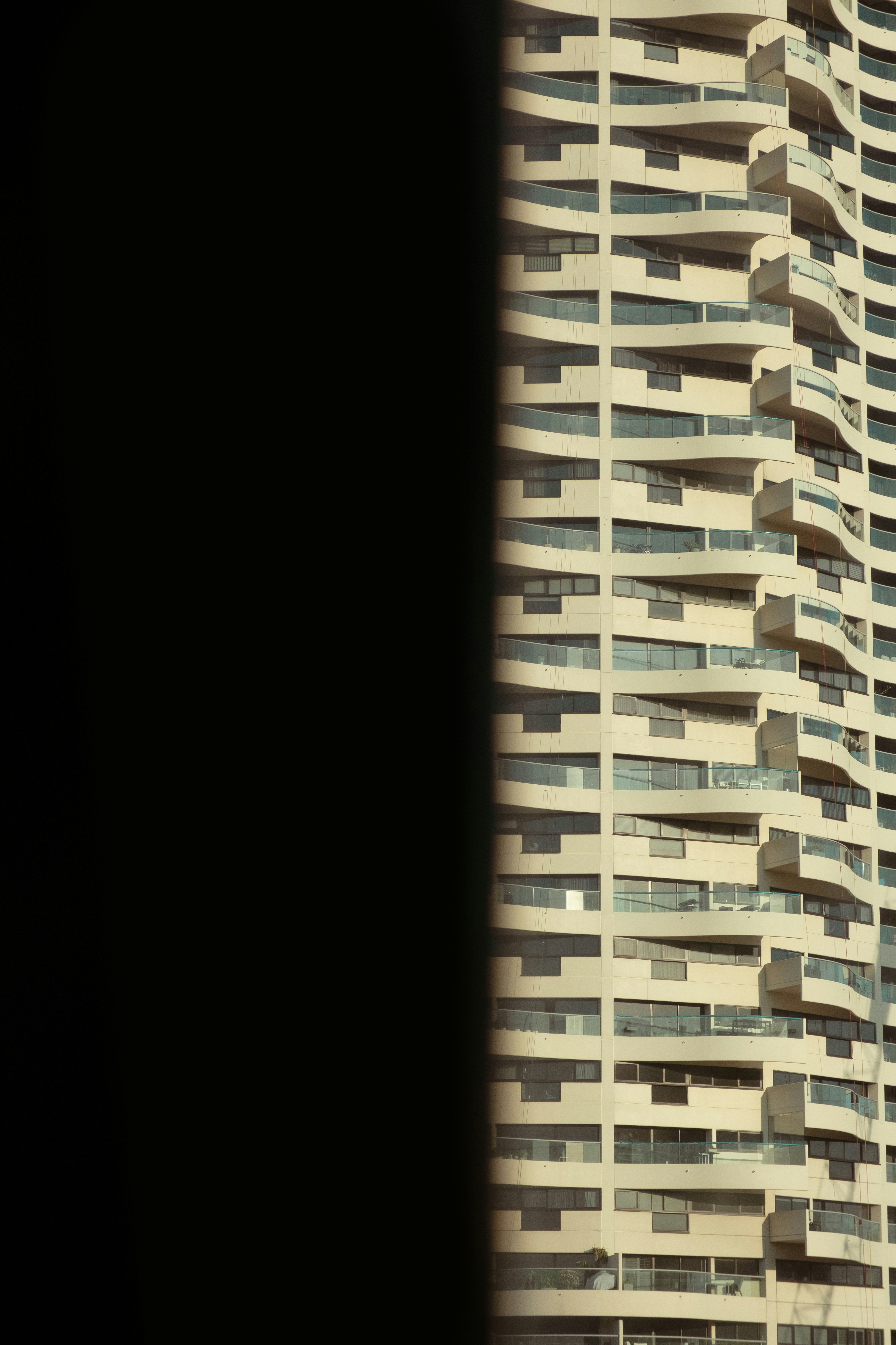A tall building with balconies on top of it