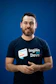 A man with a beard wearing a t - shirt that says ingles devs