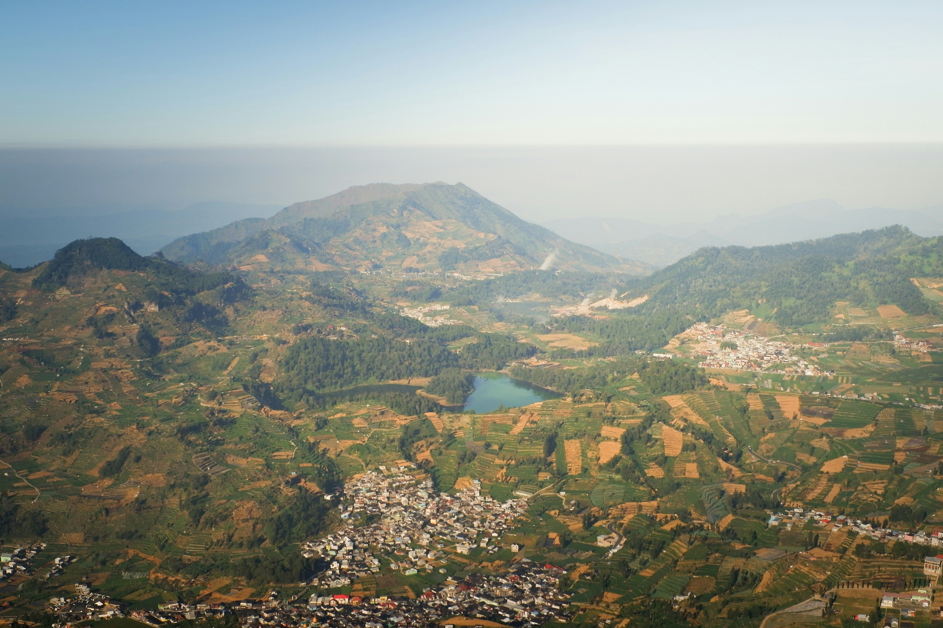 An aerial view of a city and mountains