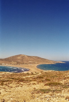 A view of a body of water with a mountain in the background