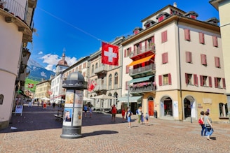 A street scene with people walking around and buildings in the background
