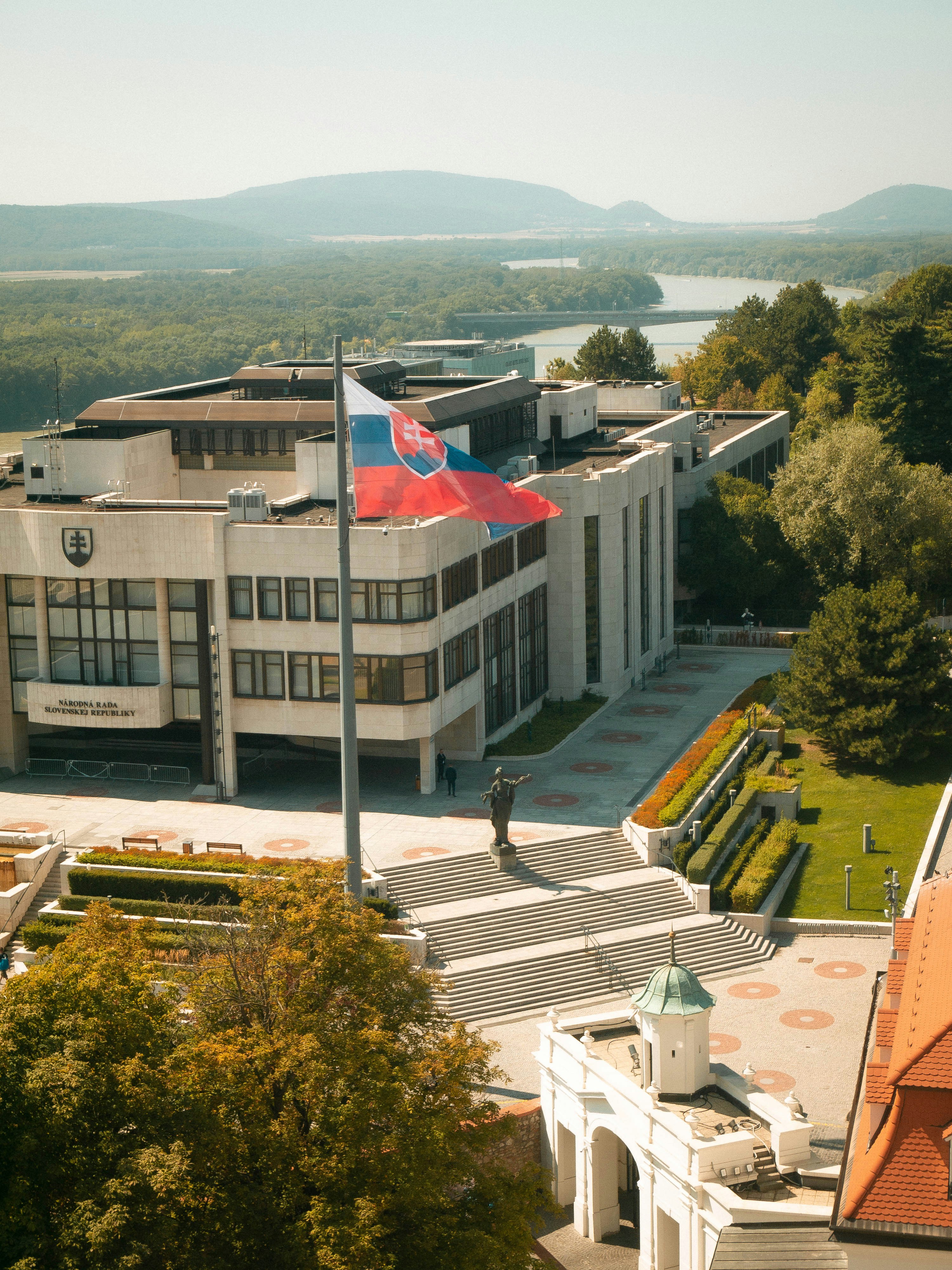 A large building with a flag on top of it