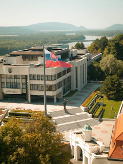 A large building with a flag on top of it