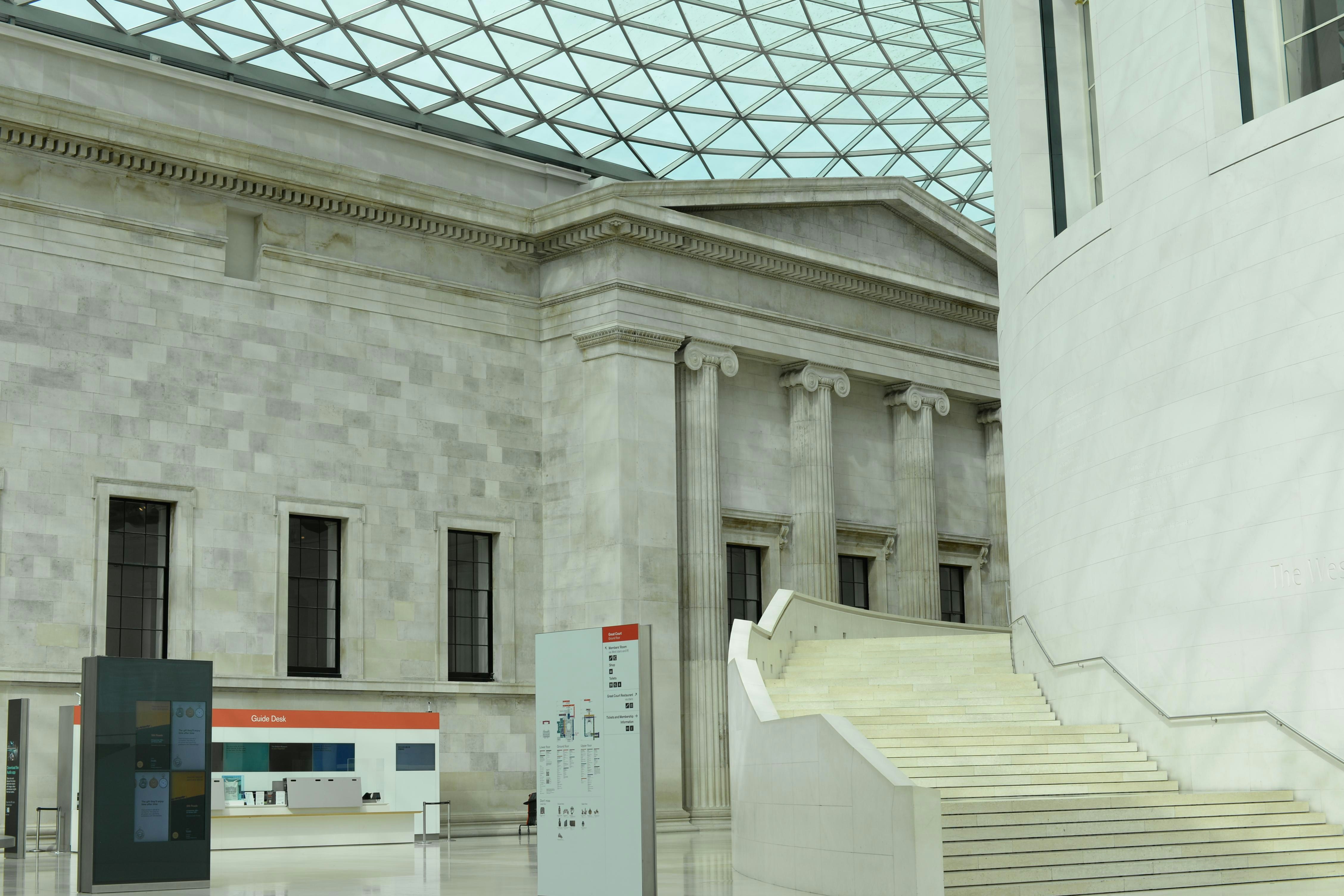 A white building with a glass roof and stairs