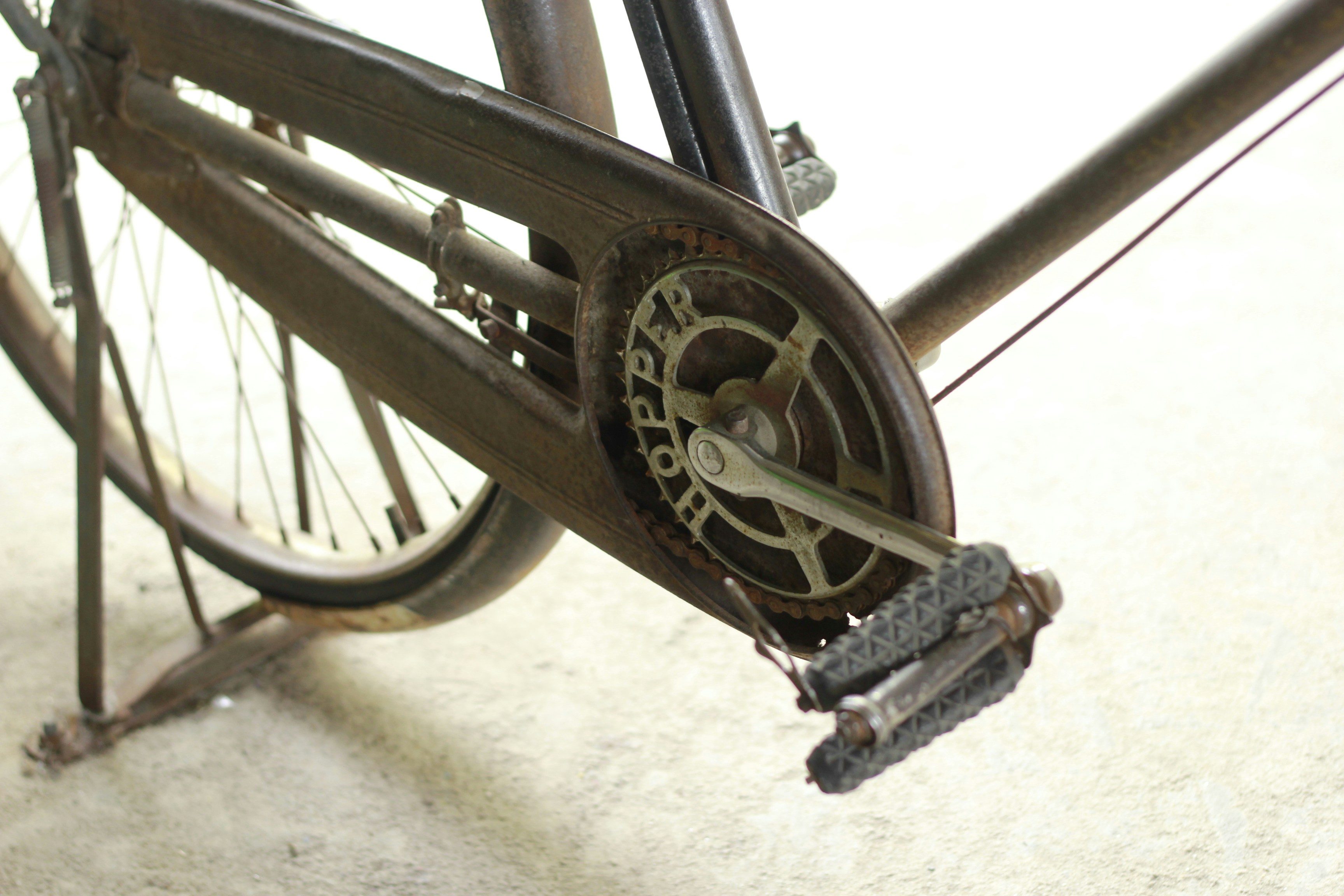 A close up of a bike with a clock on the front wheel