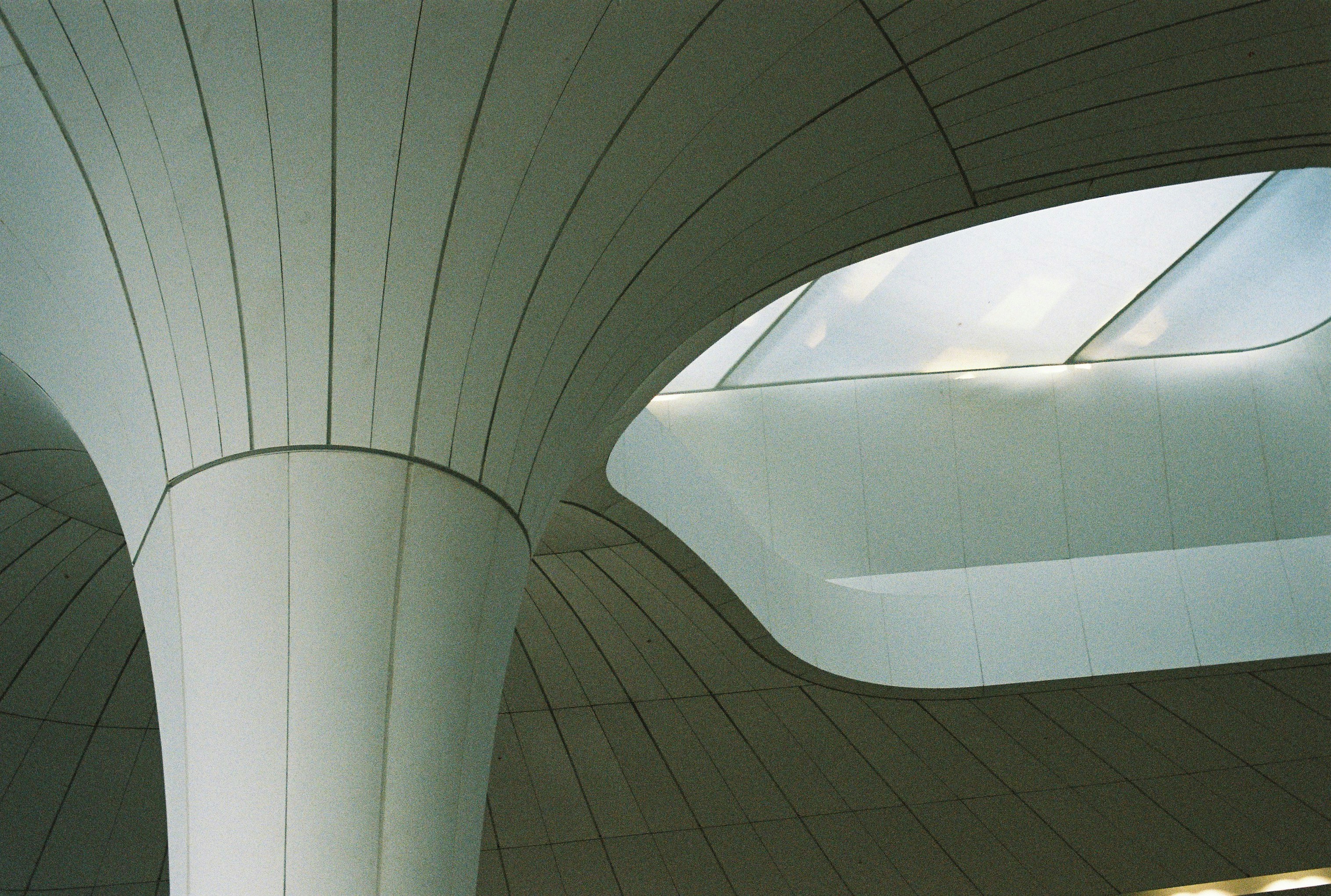 A large white building with a skylight above it