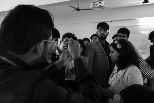 A group of people standing around each other