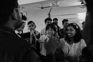 A group of people standing around each other