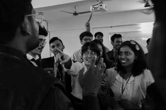 A group of people standing around each other