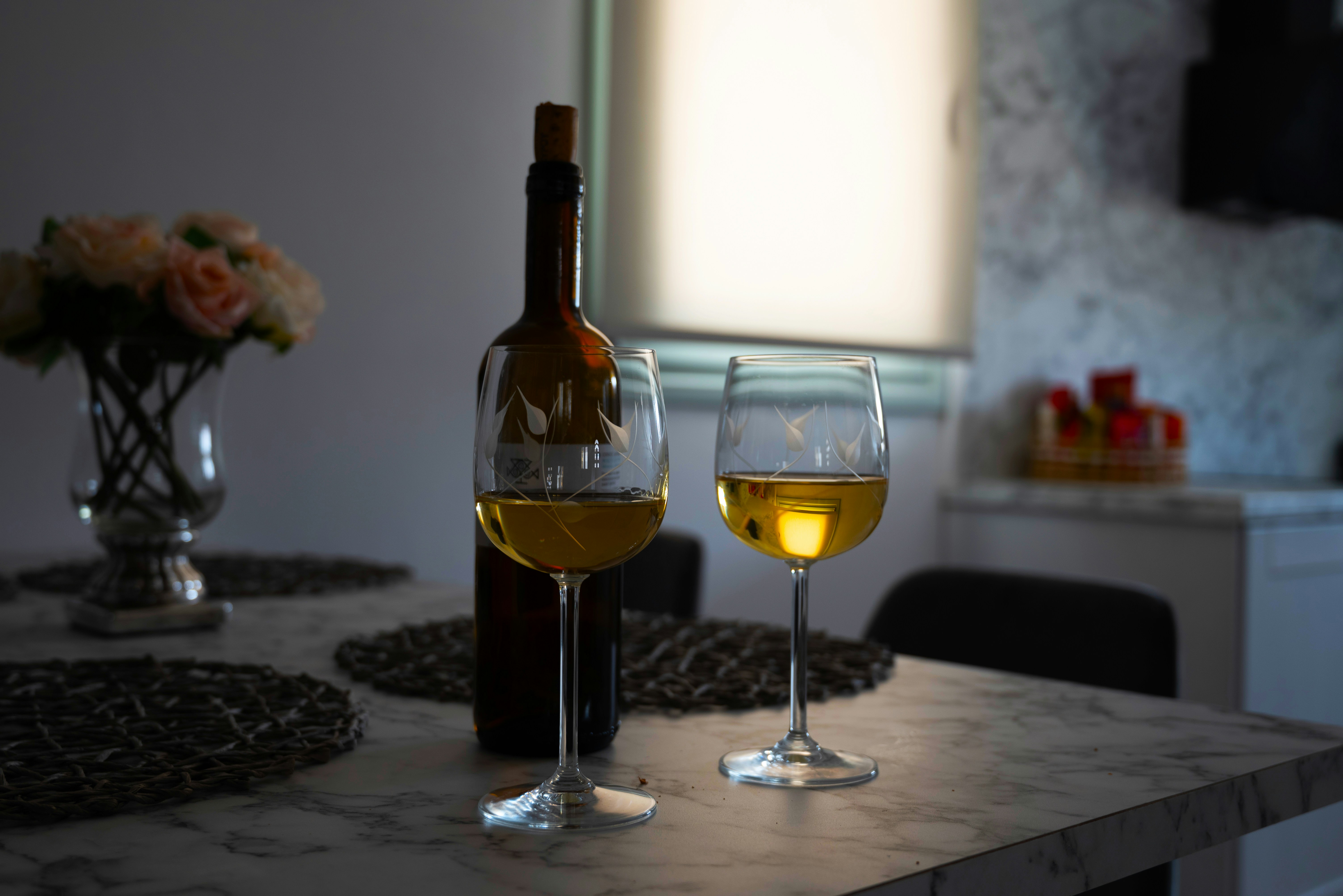 Two glasses of wine on a table