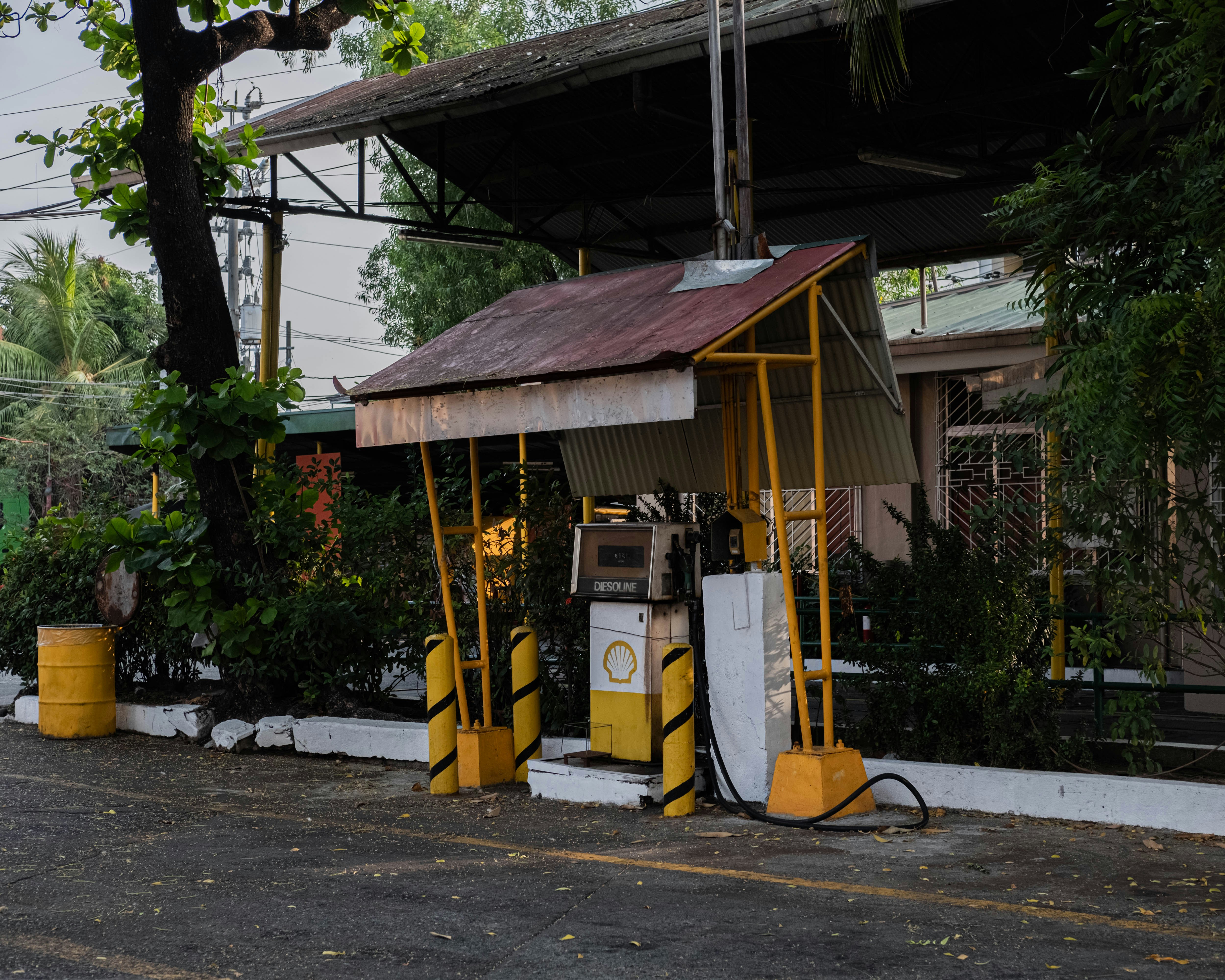Used electric cars parked at a lot while charging at public stations