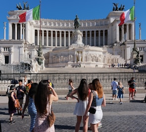 A group of people standing in front of a building