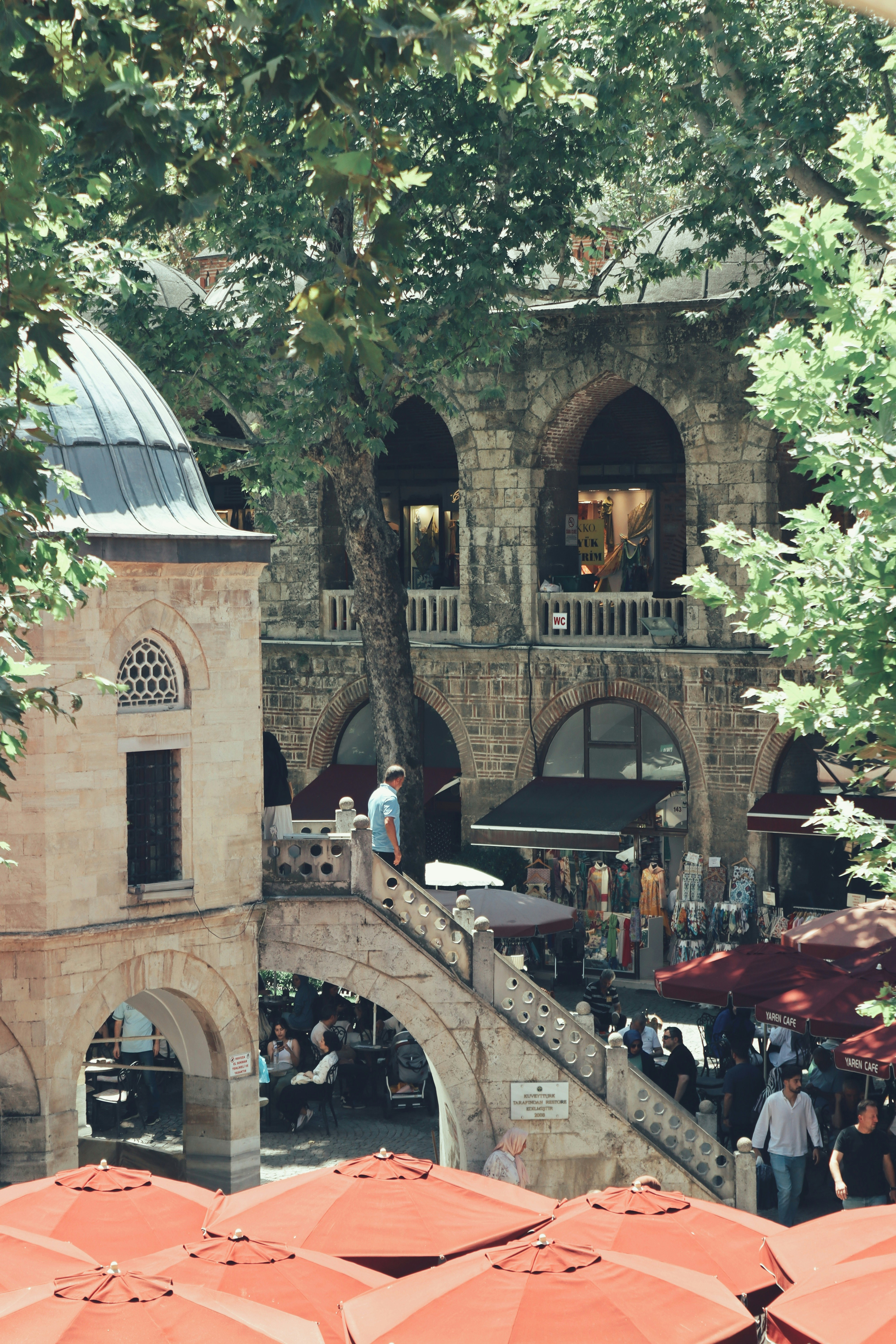 A bunch of umbrellas that are in front of a building