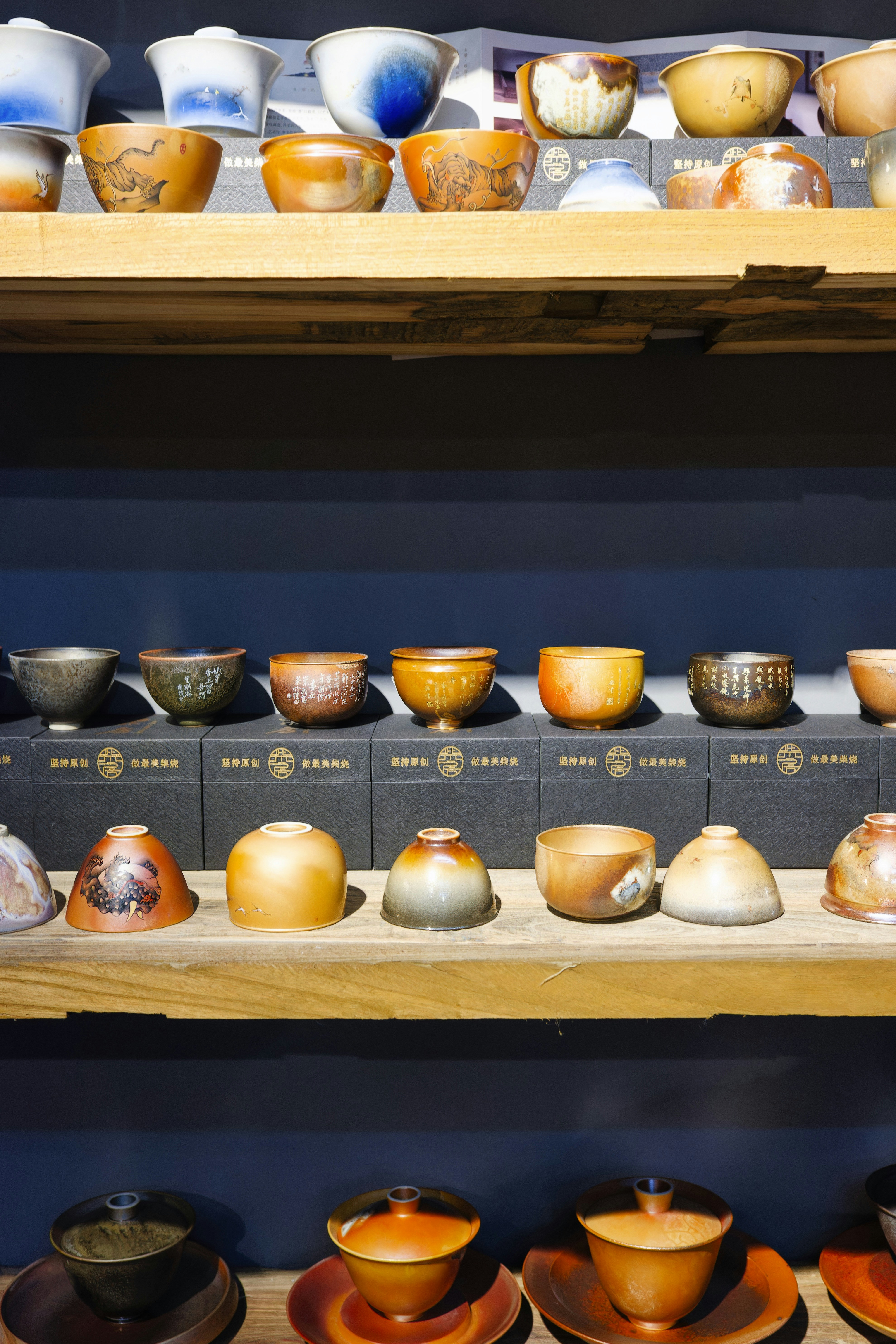 A shelf filled with lots of different types of bowls