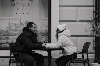 A man and a woman sitting at a table
