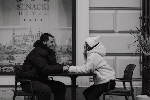 A man and a woman sitting at a table