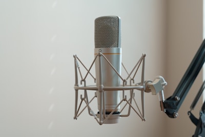 A microphone attached to a wall next to a window