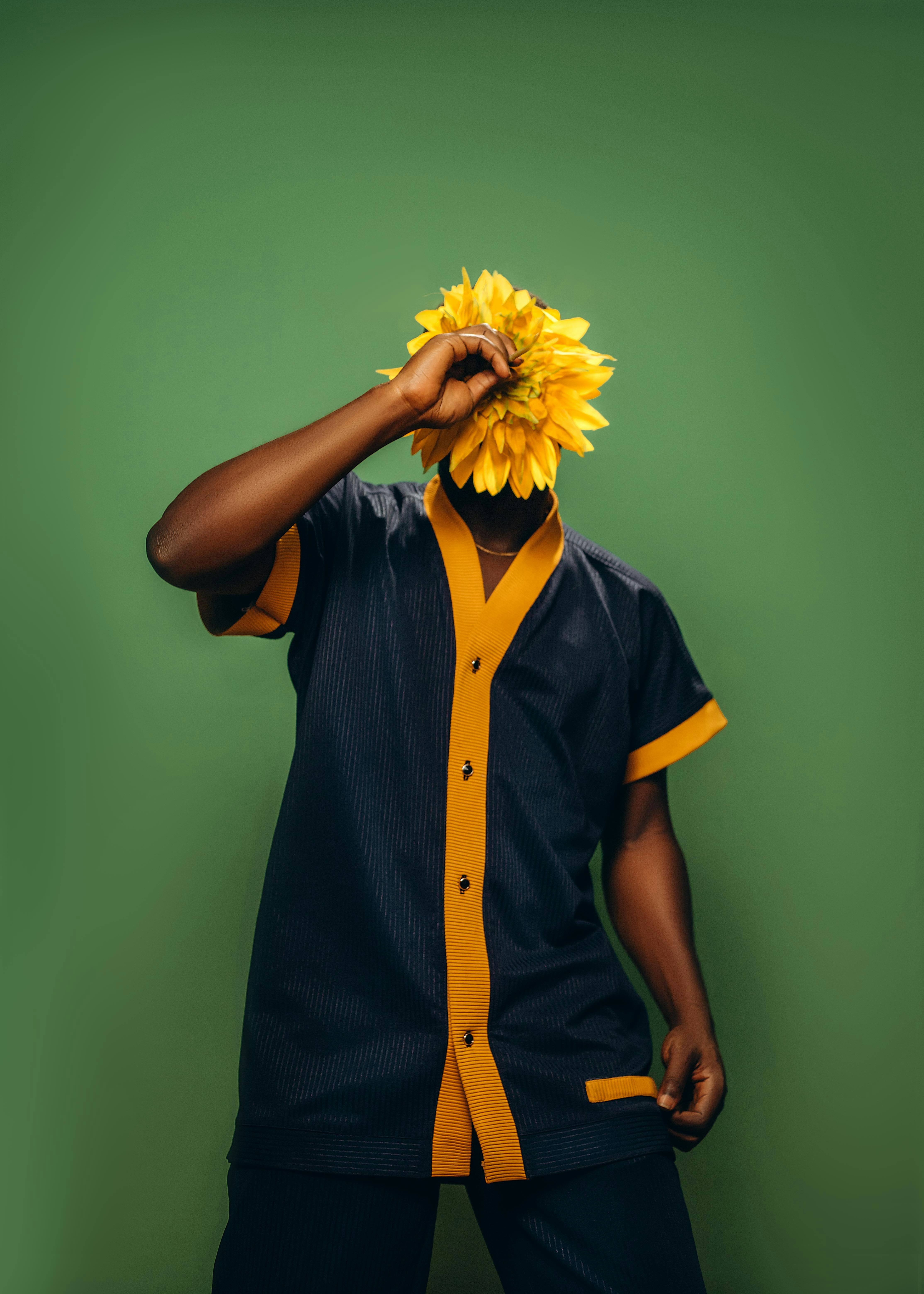 A man with a sunflower on his head