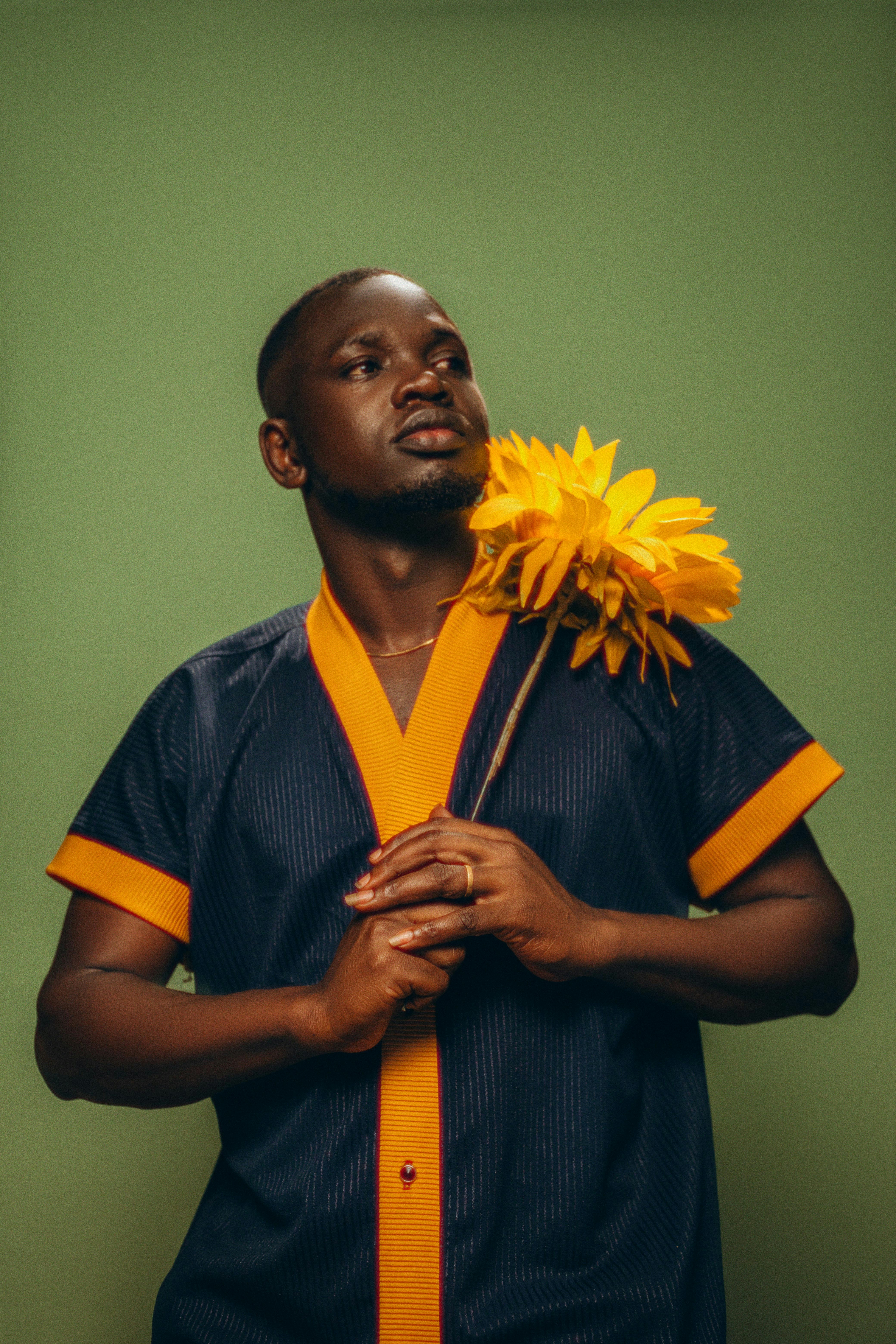 A man with a flower in his hand