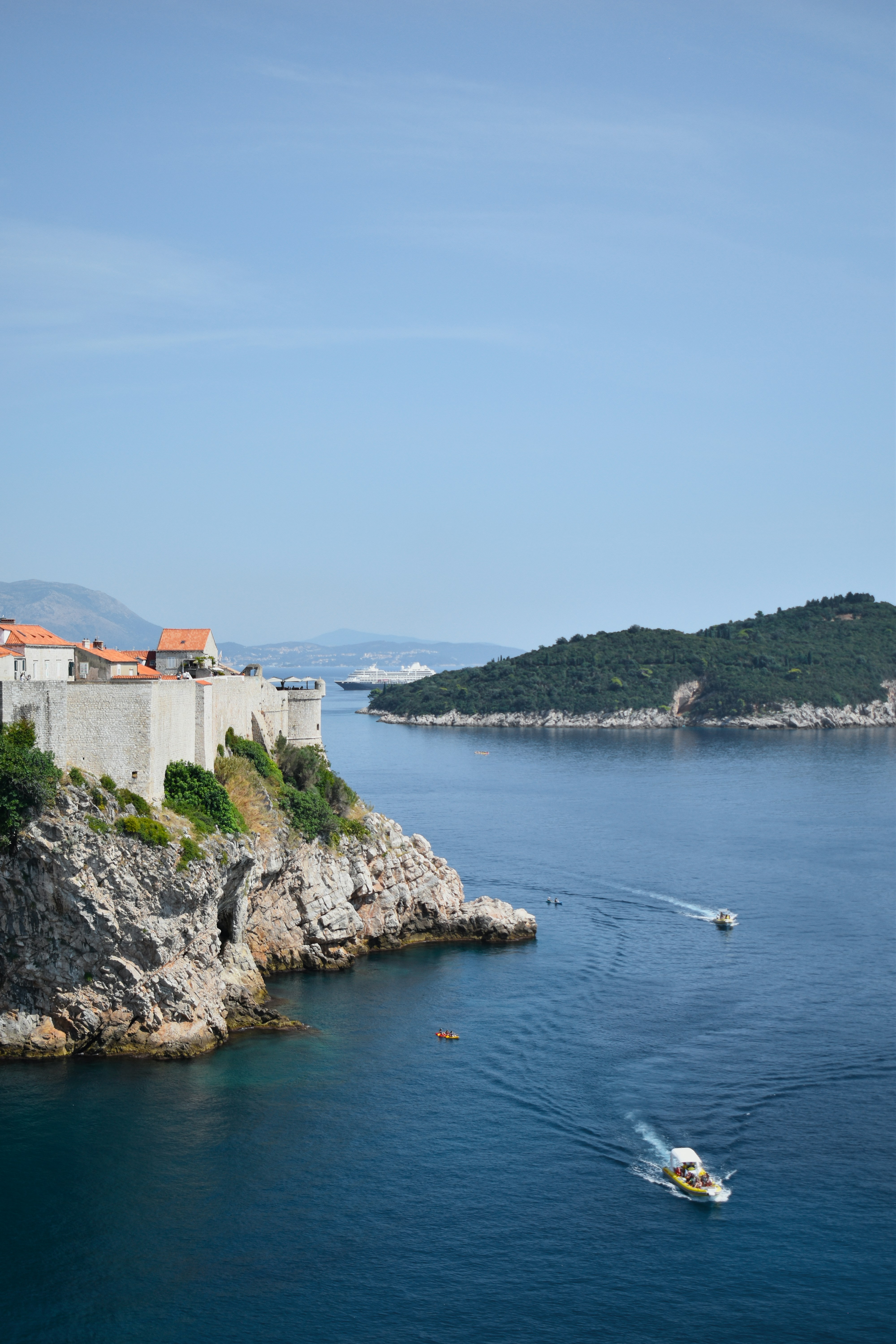A boat is in the water near a castle