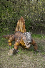 A statue of a dinosaur laying on its back