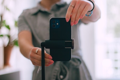 A woman taking a picture with her cell phone