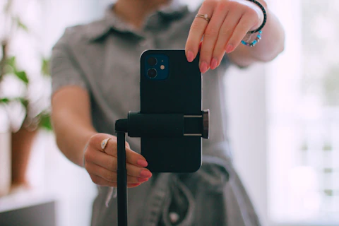 A woman taking a picture with her cell phone