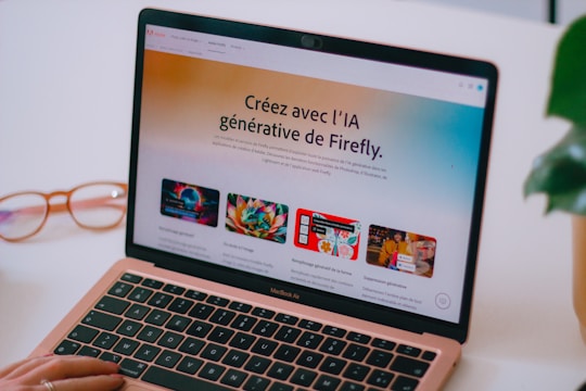 A laptop computer sitting on top of a white desk