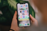 A person holding a cell phone in their hand