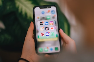 A person holding a cell phone in their hand