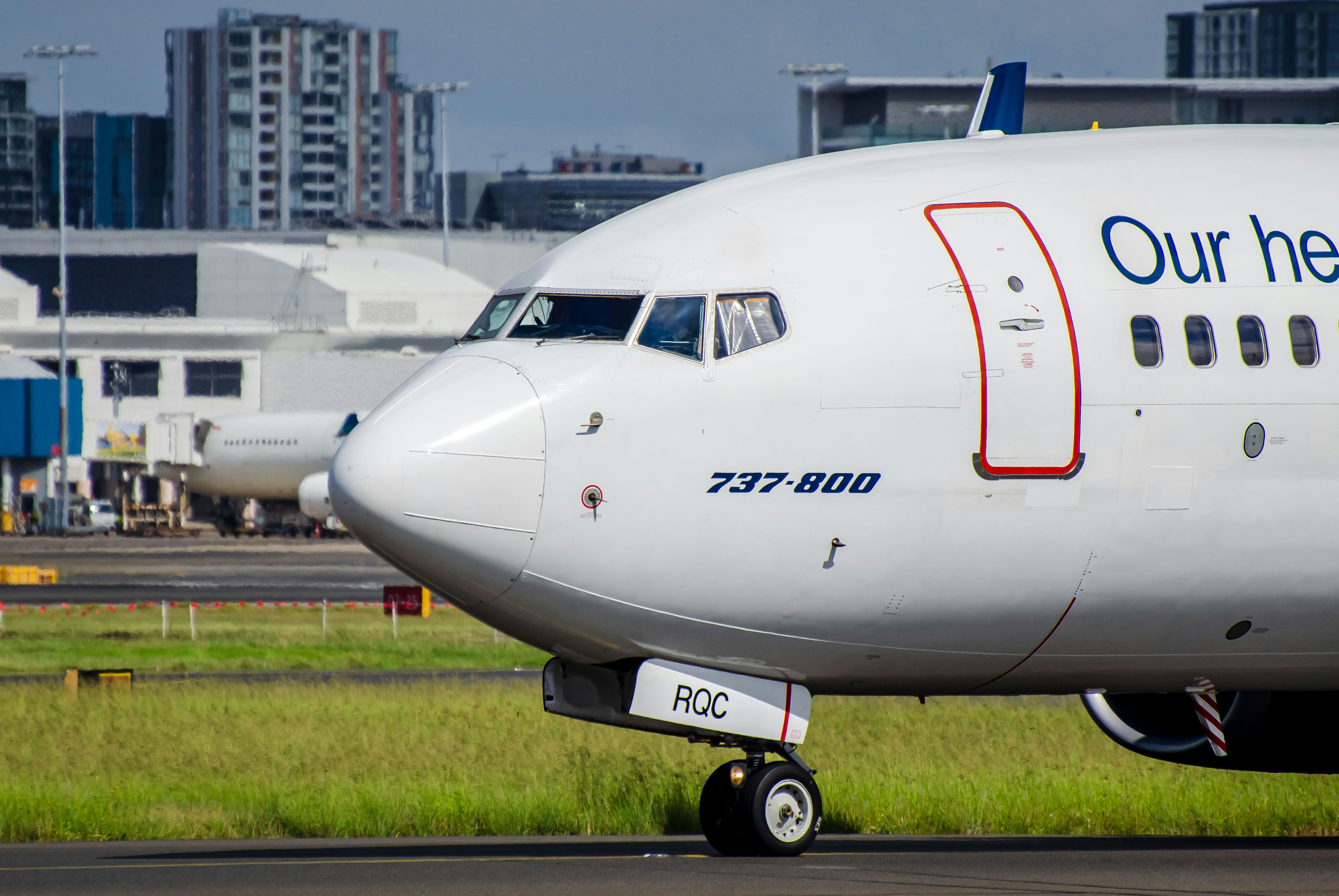A large jetliner sitting on top of an airport runway