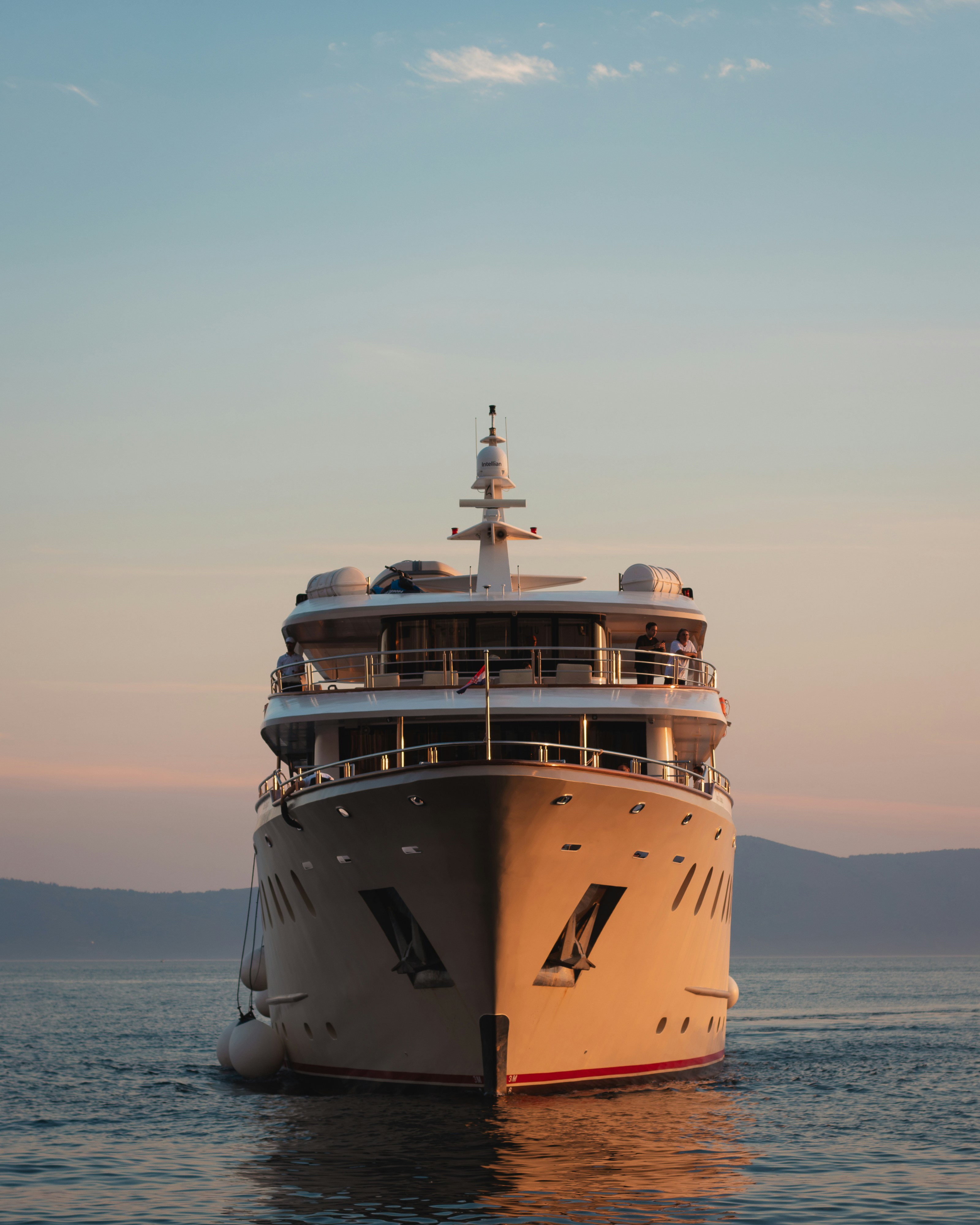 A large boat floating on top of a body of water