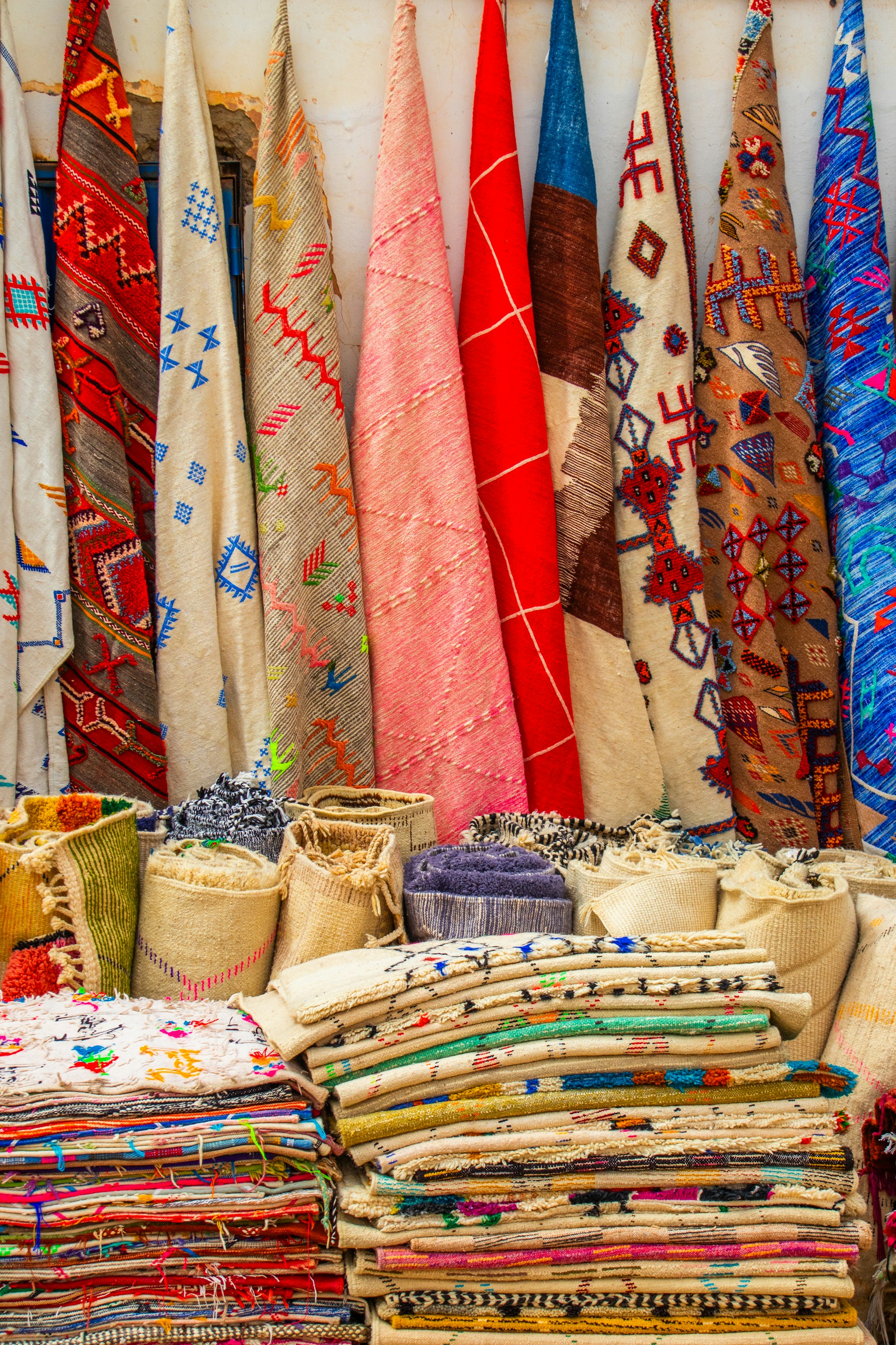 A table topped with lots of different colored ties