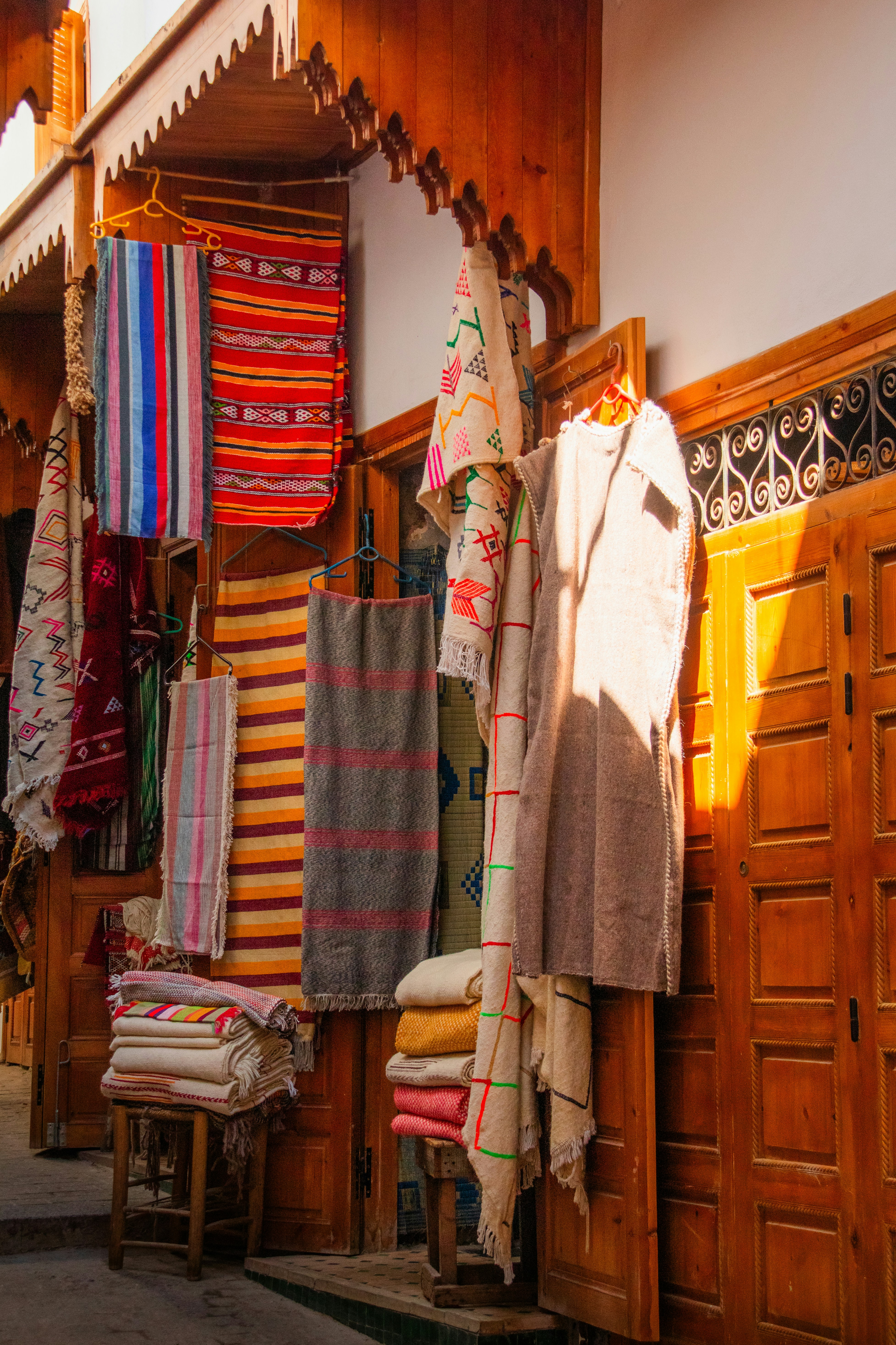 A store with a lot of clothes hanging on the wall