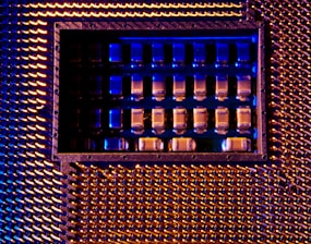 A close up of a metal structure with blue lights