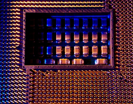 A close up of a metal structure with blue lights