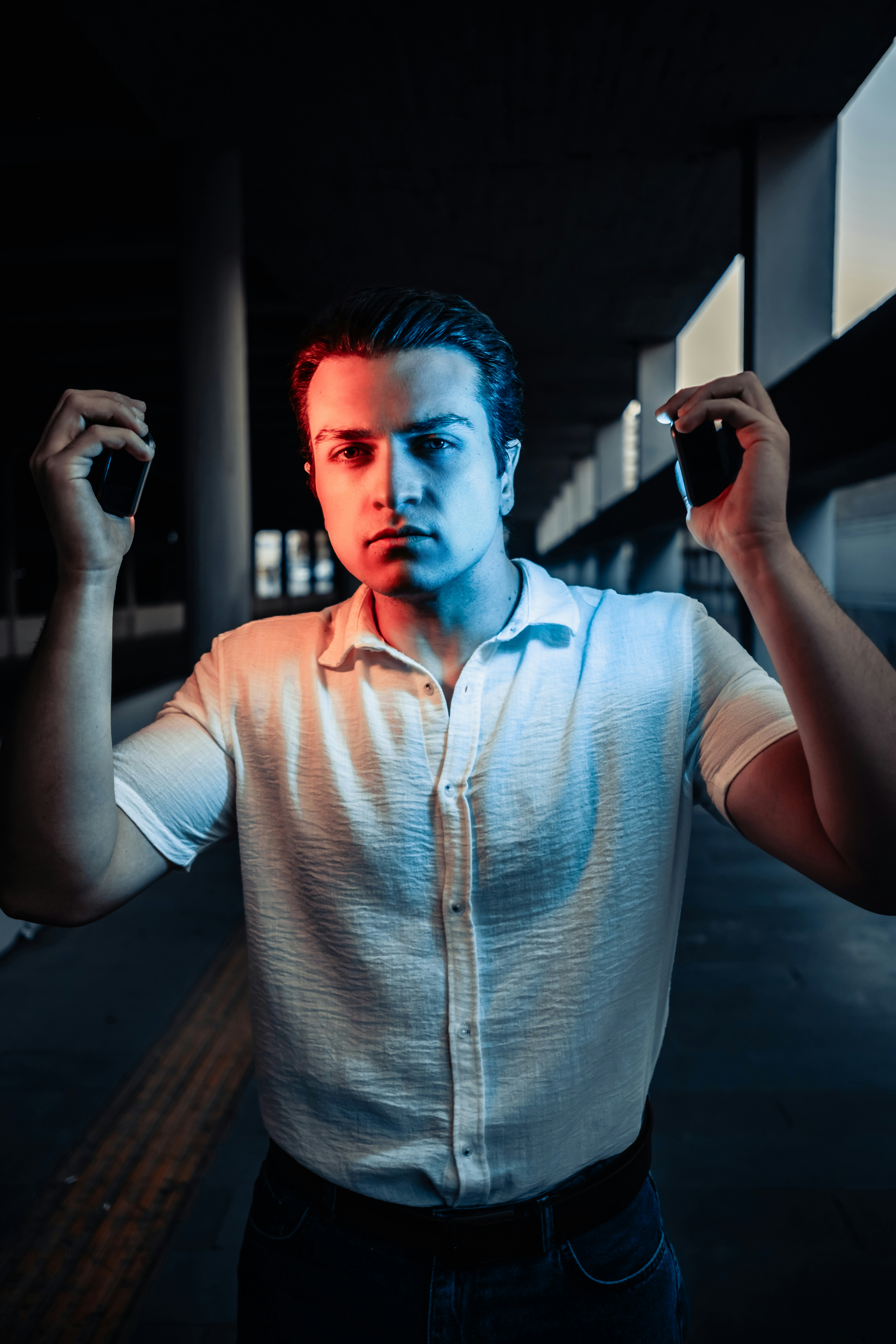 A man holding a cigarette in his right hand